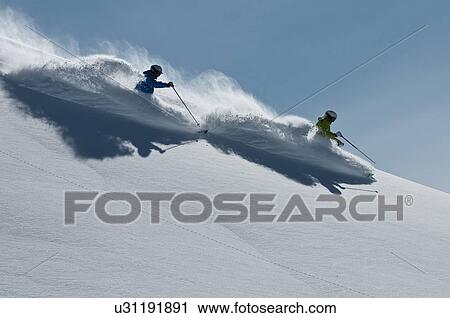 Female and male skiers racing downhill, Obergurgl, Austria View Large Photo Image Stock Image - Female and male skiers racing downhill, Obergurgl, Austria. Fotosearch