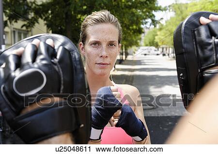 Female boxer and personal trainer in park View Large Photo Image Stock Image - Female boxer and personal trainer in park. Fotosearch