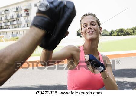 Female boxer training in park View Large Photo Image Stock Photo - Female boxer training in park. Fotosearch