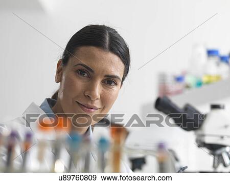 Female researcher in laboratory next to microscopes. View Large Photo Image Stock Photo - Female researcher in laboratory next to microscopes.. Fotosearch