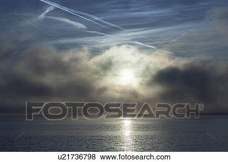 Stock Photo - Lake Maggiore, mist and sunlight, Stresa, Italy. Fotosearch
