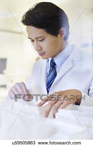 Male pharmacist searching for medicine for prescription View Large Photo Image Stock Image - Male pharmacist searching for medicine for prescription. Fotosearch