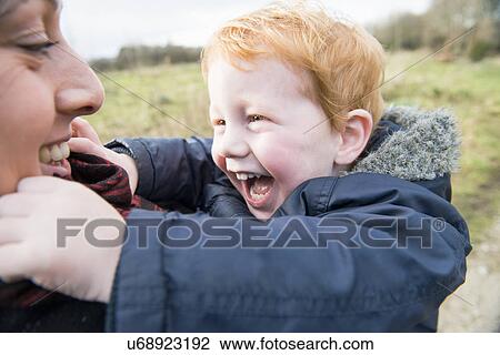 Male toddler hugging his mother View Large Photo Image Stock Image - Male toddler hugging his mother. Fotosearch