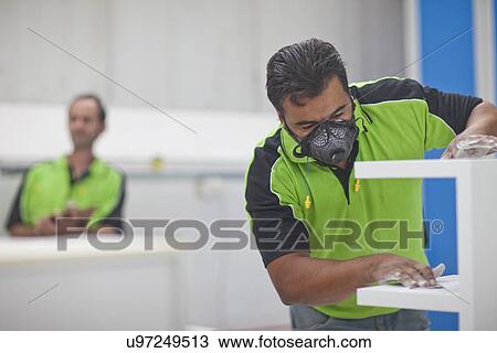 Man sanding wood products in carpenters workshop View Large Photo Image Stock Image - Man sanding wood products in carpenters workshop. Fotosearch