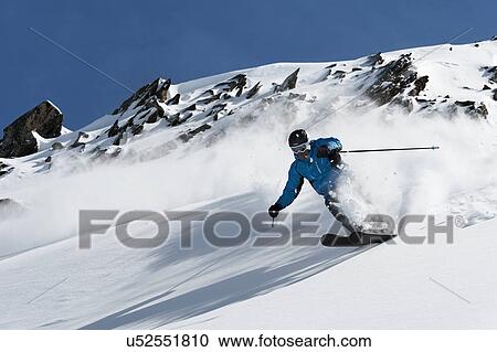 Man skiing downhill, Obergurgl, Austria View Large Photo Image Stock Image - Man skiing downhill, Obergurgl, Austria. Fotosearch
