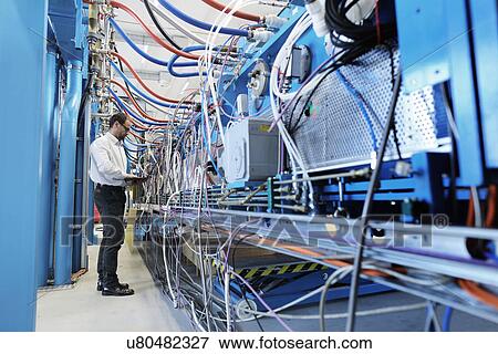 Manager monitoring industrial equipment View Large Photo Image Stock Photo - Manager monitoring industrial equipment. Fotosearch