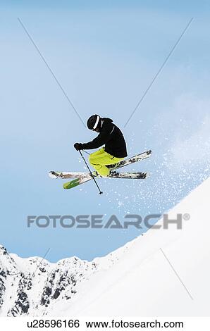 Mid adult male skier mid air, Obergurgl, Austria View Large Photo Image Stock Photograph - Mid adult male skier mid air, Obergurgl, Austria. Fotosearch