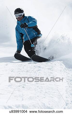 Picture - Mid adult male skier on slope, Obergurgl, Austria. Fotosearch