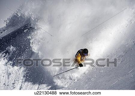 Stock Photo - Mid adult male skier speeding on hill, Obergurgl, Austria. Fotosearch