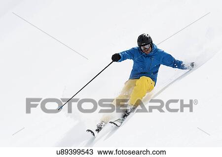 Mid adult man skiing downhill, Obergurgl, Austria View Large Photo Image Stock Image - Mid adult man skiing downhill, Obergurgl, Austria. Fotosearch