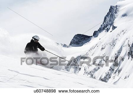 Mid adult man skiing downhill, Obergurgl, Austria View Large Photo Image Stock Photo - Mid adult man skiing downhill, Obergurgl, Austria. Fotosearch