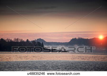 Stock Photograph - Mist on Lake Maggiore, Lombardy, Italy. Fotosearch