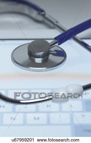 Online medicine. An acoustic stethoscope on the screen of a tablet computer View Large Photo Image Stock Image - Online medicine. An acoustic stethoscope on the screen of a tablet computer. Fotosearch