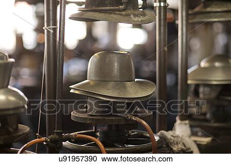 Stock Image - Panama hat mould in milliners workshop. Fotosearch