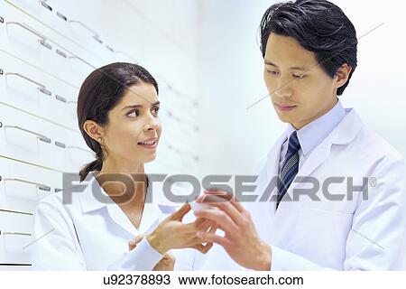 Pharmacists checking medication in pharmacy View Large Photo Image Stock Image - Pharmacists checking medication in pharmacy. Fotosearch