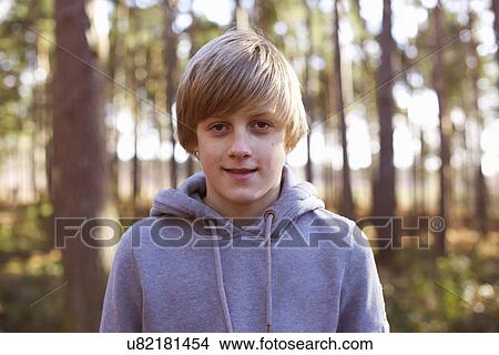 Picture - Portrait of a boy in the woods. Fotosearch