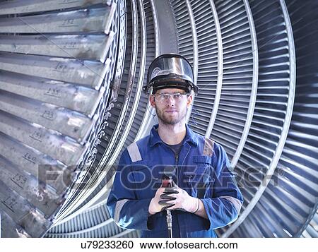 Portrait of apprentice engineer in steam turbine repair workshop View Large Photo Image Stock Image - Portrait of apprentice engineer in steam turbine repair workshop. Fotosearch