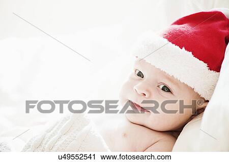 Portrait of baby boy in santa hat View Large Photo Image Stock Image - Portrait of baby boy in santa hat. Fotosearch