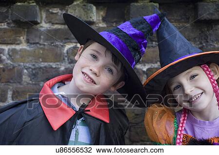 Portrait of boy and girl in halloween costumes View Large Photo Image Stock Image - Portrait of boy and girl in halloween costumes. Fotosearch