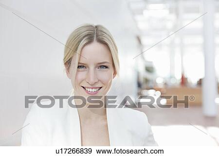 Stock Photo - Portrait of business woman at airport. Fotosearch