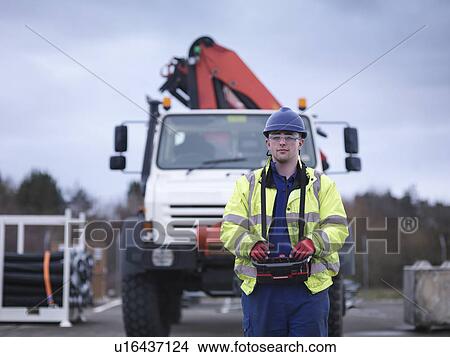 Portrait of Emergency Response Team worker training with truck crane View Large Photo Image Picture - Portrait of Emergency Response Team worker training with truck crane. Fotosearch