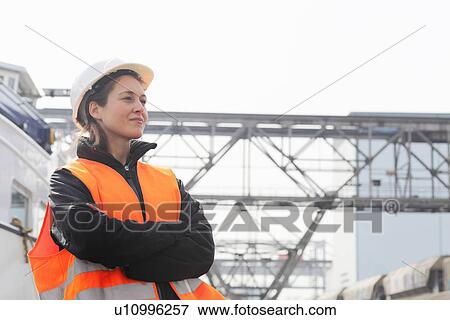 Stock Photo - Portrait of female dockworker. Fotosearch