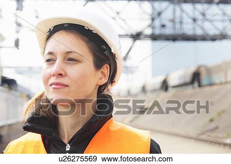 Stock Photo - Portrait of female dockworker. Fotosearch