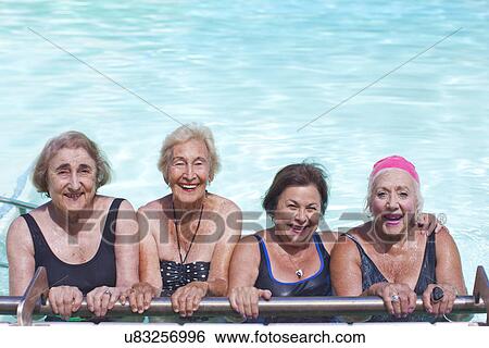 Stock Photograph - Portrait of four senior women in swimming pool. Fotosearch