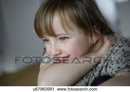 Portrait of girl resting on elbow View Large Photo Image Stock Image - Portrait of girl resting on elbow. Fotosearch