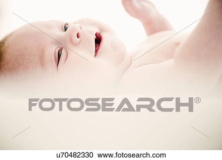 Portrait of smiling baby boy 4 months old View Large Photo Image Stock Image - Portrait of smiling baby boy 4 months old. Fotosearch