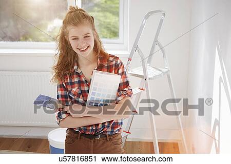 Portrait of teenage girl holding paint brush and swatch View Large Photo Image Stock Image - Portrait of teenage girl holding paint brush and swatch. Fotosearch