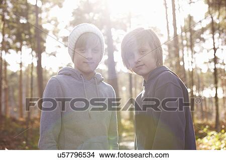 Portrait of twin brothers in woods View Large Photo Image Picture - Portrait of twin brothers in woods. Fotosearch