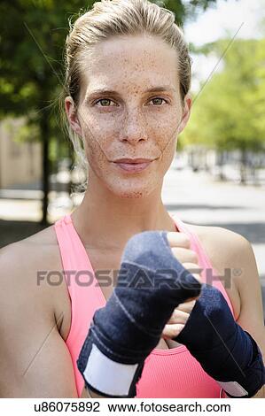 Portrait of young female boxer in park View Large Photo Image Stock Image - Portrait of young female boxer in park. Fotosearch
