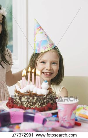 Portrait of young girl enjoying her birthday party View Large Photo Image Stock Image - Portrait of young girl enjoying her birthday party. Fotosearch
