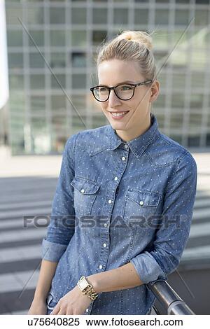 Stock Photography - Portrait of young woman at airport. Fotosearch