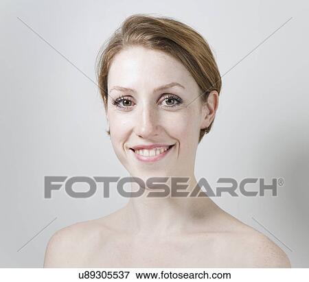 Stock Photo - Portrait of young woman, bare shoulders. Fotosearch