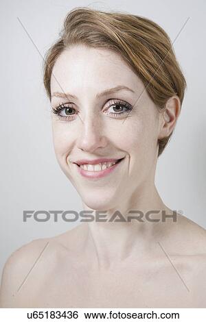 Stock Photograph - Portrait of young woman, bare shoulders. Fotosearch