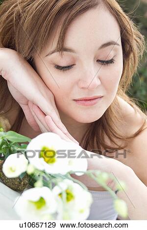 Portrait of young woman daydreaming View Large Photo Image Stock Photo - Portrait of young woman daydreaming. Fotosearch