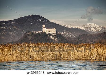 Stock Photo - Reeds and Castello di Angera, Lake Maggiore, Italy. Fotosearch