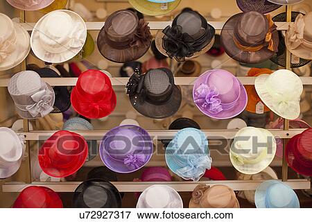 Stock Photo - Rows of colorful hats in traditional milliners shop. Fotosearch