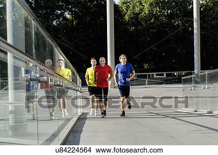 Runner alongside glass balustrade View Large Photo Image Picture - Runner alongside glass balustrade. Fotosearch