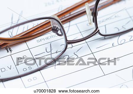 Stock Photo - Spectacles and eye testing form document. Fotosearch