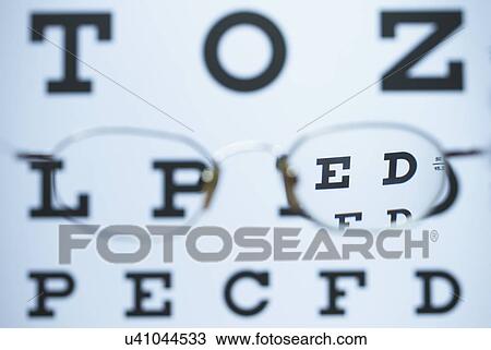Spectacles with one myopic lens (negative) and the other is missing are used to look at the Snellen eye chart. The image is in focus when looking through the lens View Large Photo Image Stock Image - Spectacles with one myopic lens (negative) and the other is missing are used to look at the Snellen eye chart. The image is in focus when looking through the lens. Fotosearch