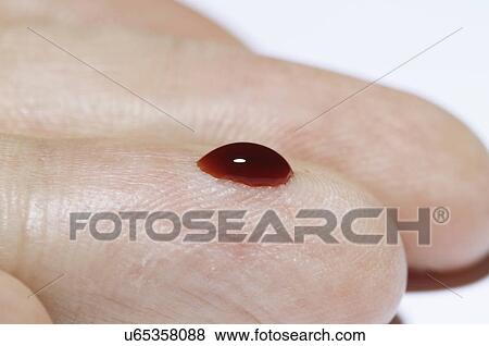 (Synthetic) Blood drop on a male finger View Large Photo Image Stock Photo - (Synthetic) Blood drop on a male finger. Fotosearch