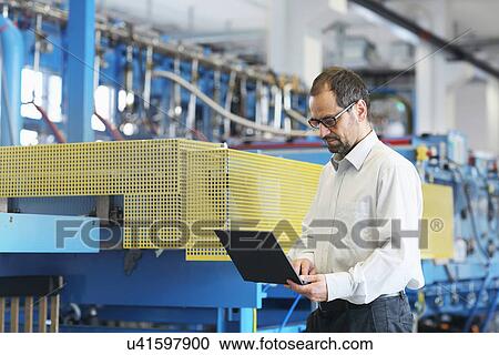 Technical manager checking information on laptop View Large Photo Image Stock Image - Technical manager checking information on laptop. Fotosearch