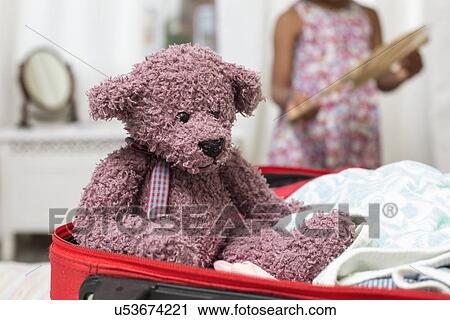 Teddy bear in open suitcase View Large Photo Image Stock Image - Teddy bear in open suitcase. Fotosearch