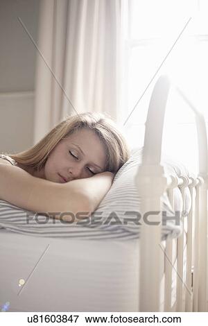Teenage girl asleep in bed View Large Photo Image Stock Photo - Teenage girl asleep in bed. Fotosearch