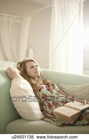Teenage girl relaxing on chaise longue with reading book View Large Photo Image Stock Photography - Teenage girl relaxing on chaise longue with reading book. Fotosearch