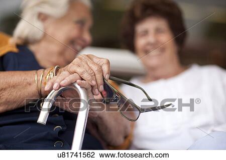 Two happy senior women chatting View Large Photo Image Stock Image - Two happy senior women chatting. Fotosearch