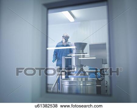 Worker mixing ingredients in pharmaceutical factory View Large Photo Image Stock Photo - Worker mixing ingredients in pharmaceutical factory. Fotosearch